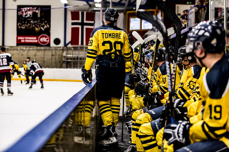 A hockey player on the bench, with clarity heavily applied