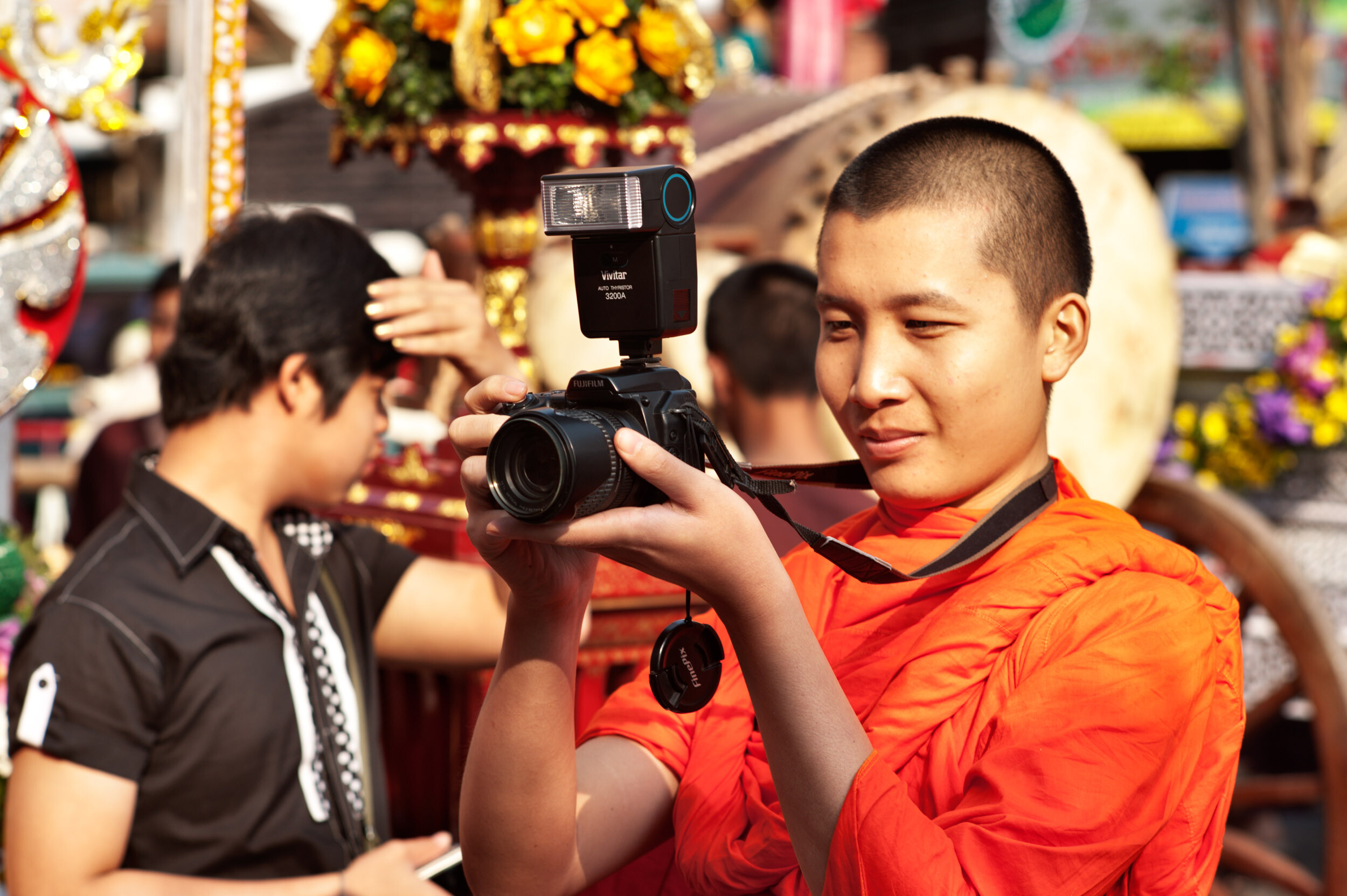Monk with a camera front light photography