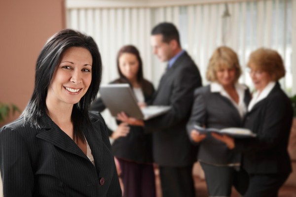 This was a business portrait, but my client wanted more than a simple headshot. It was taken late in the day meaning I had to create my own light. She wanted her team in the background working, to show when you worked with her, she had a whole team backing her up. I used a Canon 430 EX II to light the background, aiming it off a white wall and the ceiling, out of the frame. I then used a Canon 580 EX II off camera in a Westcott Apollo 28" soft box to light my client. I ratio'd the lighting so that the background light was at a 2:1 ratio with my main light. EOS 5D Mark II with EF 24-105 f/4L IS. 1/100 @ f/4, ISO 400.